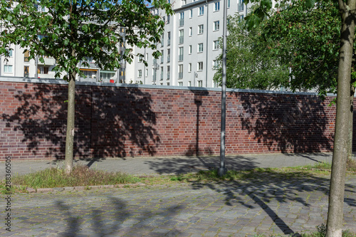 Wallpaper Mural Walking through the streets in the Friedrichshain district on a warm sunny day, Otto-Ostrowski-Strasse in Berlin Torontodigital.ca