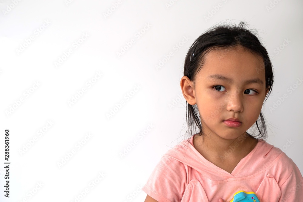 Kid girl angry before take a photo on white background., kid learning concept. Kid girl angry before take a photo on white background., kid learning concept.