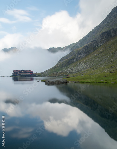 balea chalet near balea lake on transfagarasan road romania in a foggy day