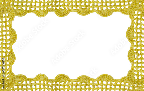 rocheted yellow lace on a golden background. photo