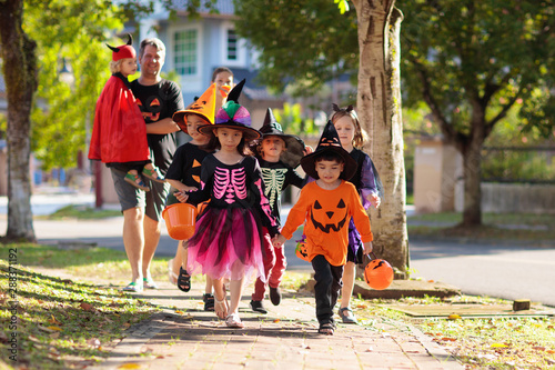 Kids trick or treat. Halloween fun for children. photo