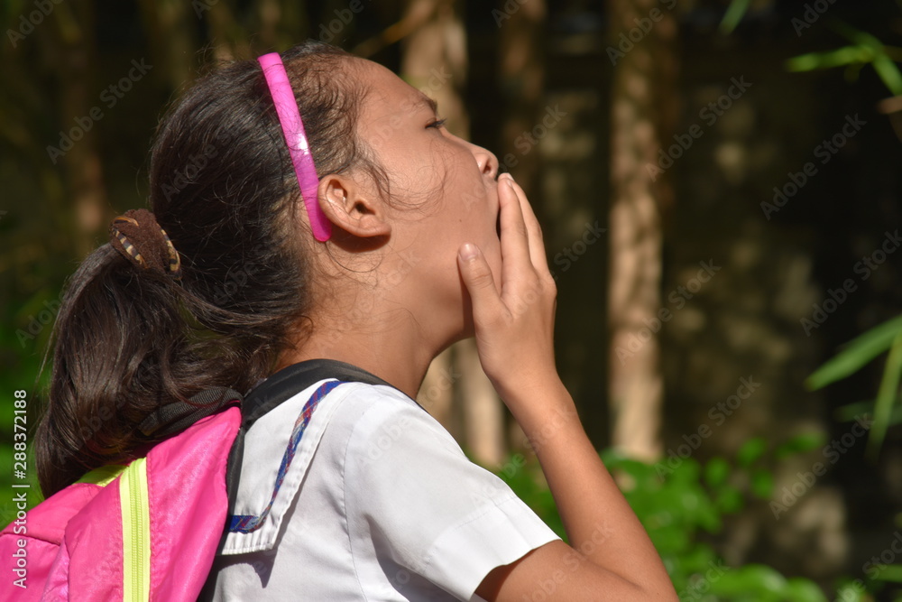 Naklejka premium A Girl Student Yawning