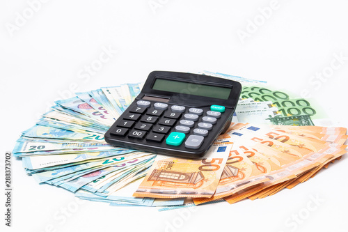 Loans and debts concept. Euro banknotes Laid out in a cicircle on white background. Money finance earning sector concept. Copy space for text. Stack of money wealth, lottery prizes or banking crises. photo