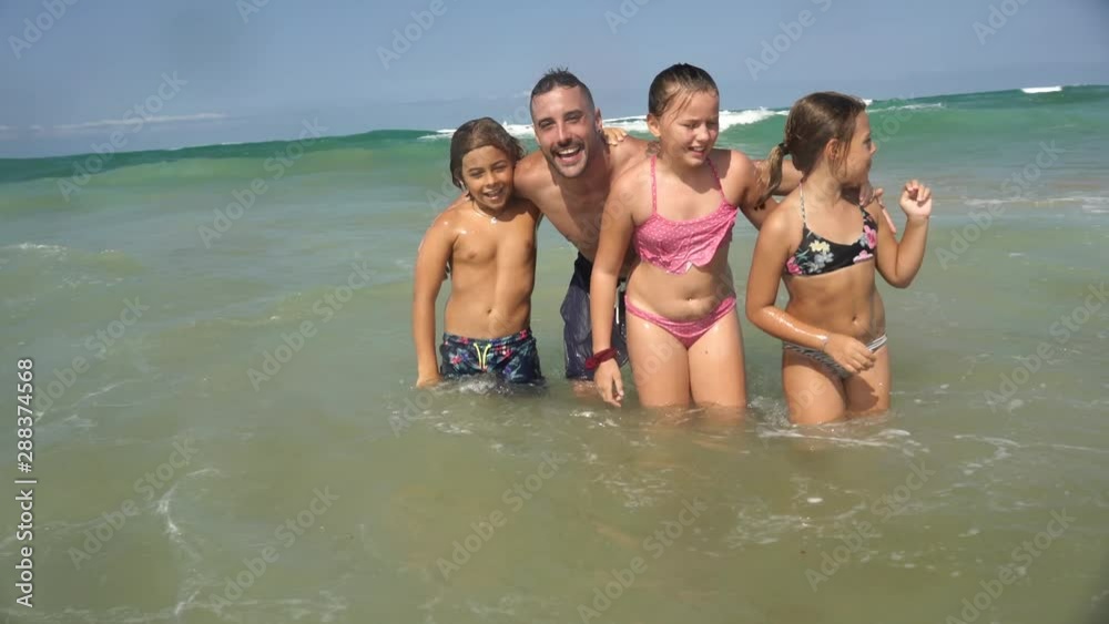 Family having fun in the waves Family having fun in the waves