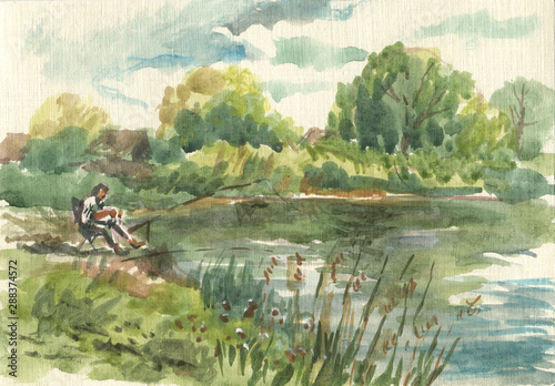 fisherman on the lake in summer