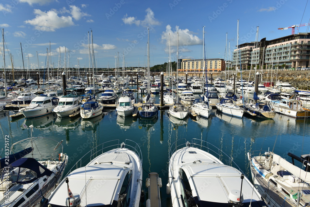 Jersey, U.K. 1st September 2019, St Helier yacht marina with a hotel and apartments on the seafront.