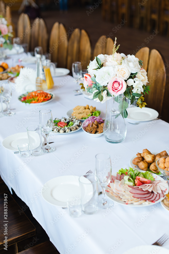 Festive wedding table setting. Empty wine glasses