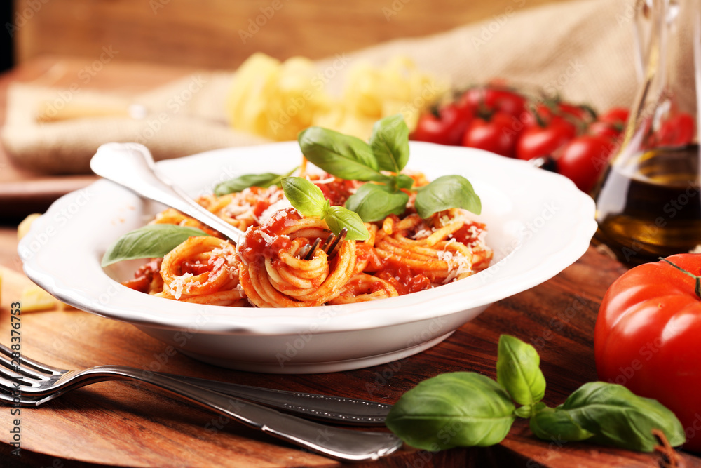 Plate of delicious spaghetti Bolognaise or Bolognese with savory minced beef and tomato sauce garnished with parmesan Plate of delicious spaghetti Bolognaise or Bolognese with savory minced beef and tomato sauce garnished with parmesan