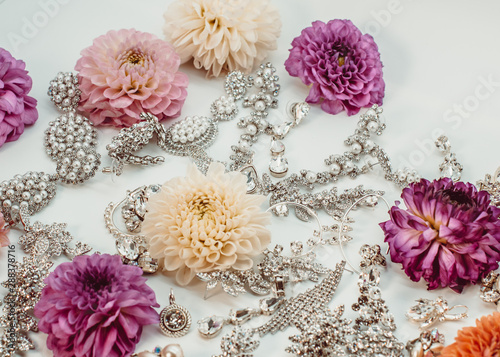 Beautiful set of jewels and flowers in a white background
