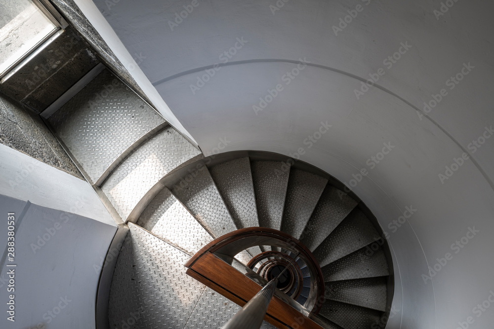 Fototapeta premium Looking down the spiral staircase of the Ponta dos Capelinhos lighthouse