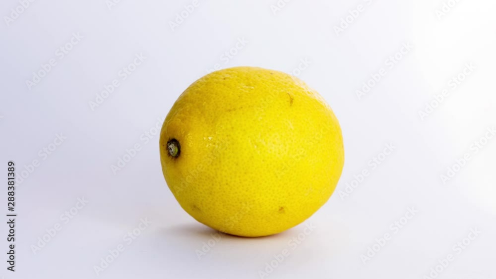Stop motion lemon rotating isolated on a white background. Seamless loop 4K movie Stop motion lemon rotating isolated on a white background. Seamless loop 4K movie