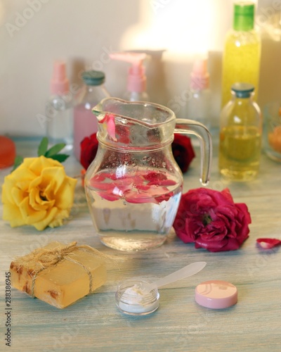 Roses, soap, petals, body care products, oil on the table, spa treatments, preparation of natural cosmetics, healthy lifestyle