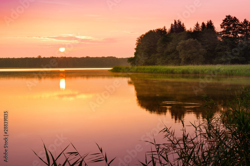 Fototapeta Naklejka Na Ścianę i Meble -  Sunrise over  Szarek Lake. Masuria. Poland.