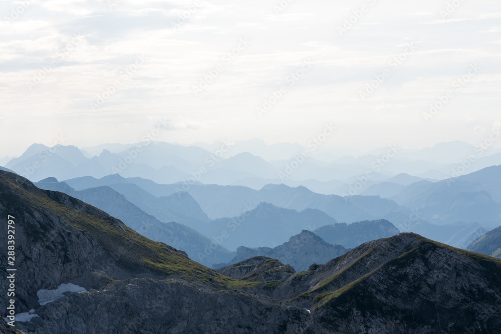 view of mountain peaks in haze, Alps view of mountain peaks in haze, Alps