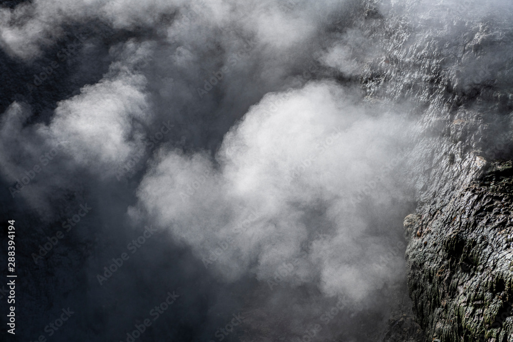 Fototapeta premium Detail of fumarole emitting gases and steam at the Jardim da Courela garden in the centre of the village of Furnas on São Miguel island in the Azores.
