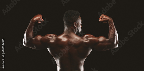 Back view of african american fitness model demonstrating athletic body
