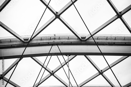 Structure of steel beams and cables in black and white