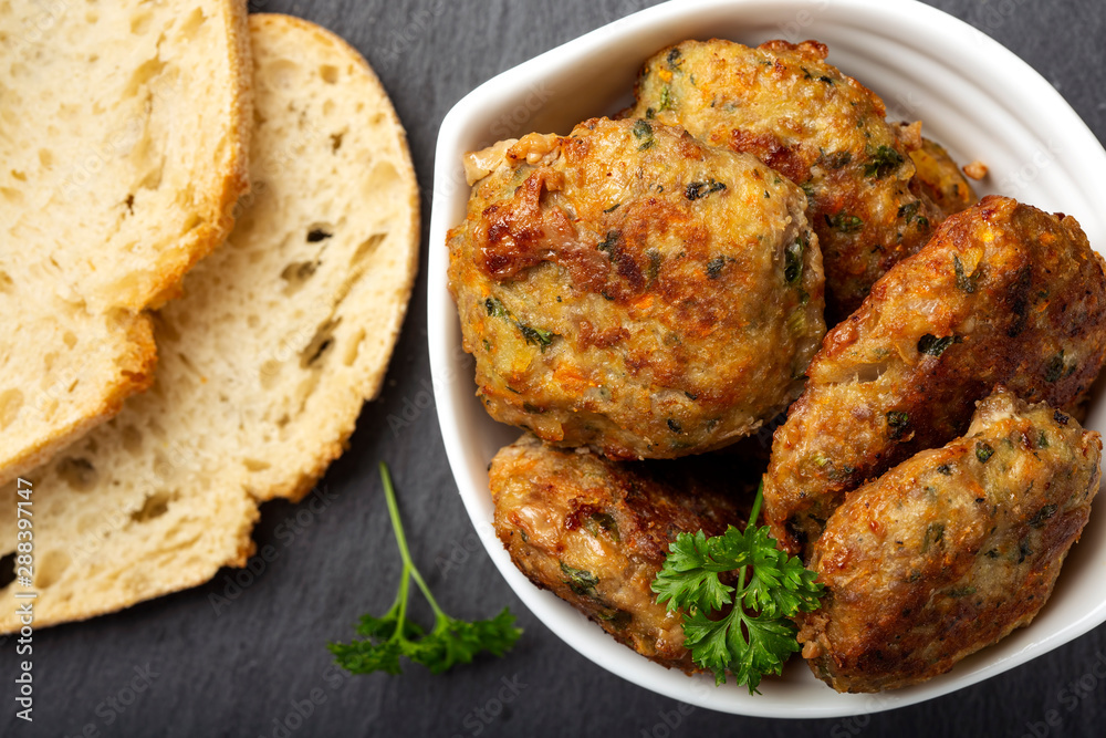 Chiftele - Romanina traditional meatballs and two slices of bread Chiftele - Romanina traditional meatballs and two slices of bread