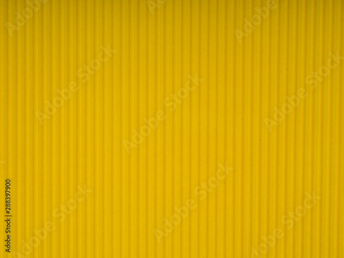 Yellow corrugated cardboard carton, texture background, colorful. Yellow corrugated cardboard carton in a colorful texture background series