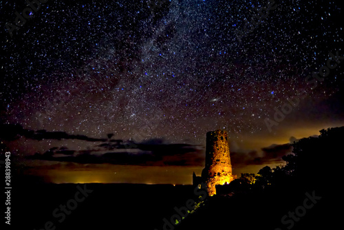 Silhouette of the historic Watch Tower on the Grand Canyon under the Milky Way night. Managed by the National Park Service. No property release needed.