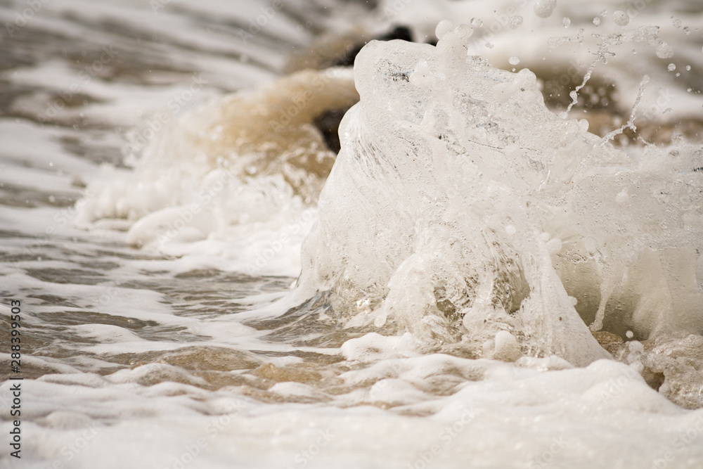 Close-up of Water Splashing onto Shore Close-up of Water Splashing onto Shore