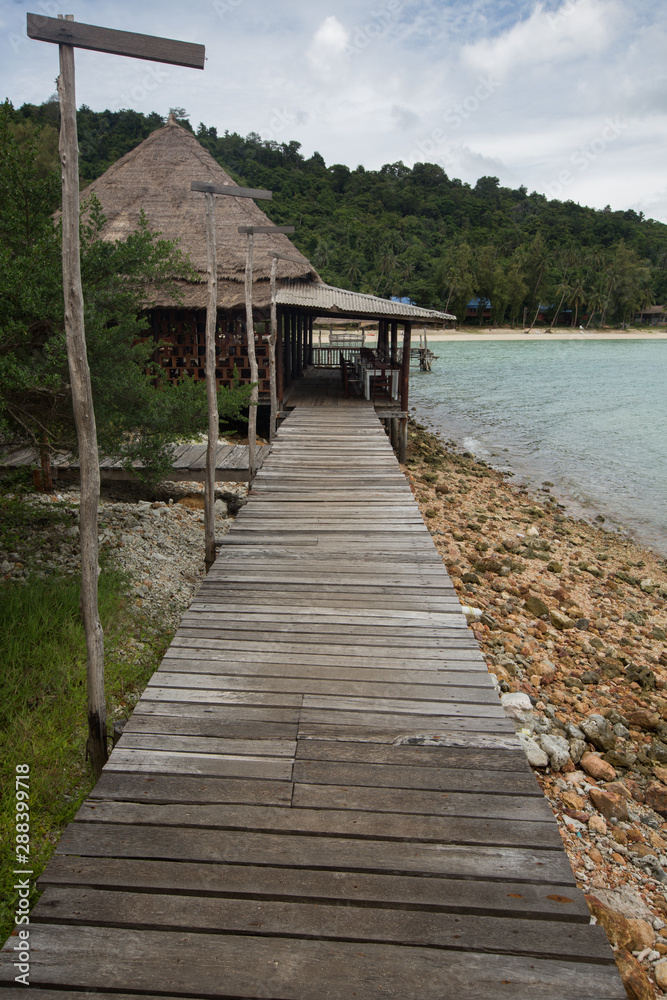 a wooden sidewalk on the beach of Koh Talul, Thailand
