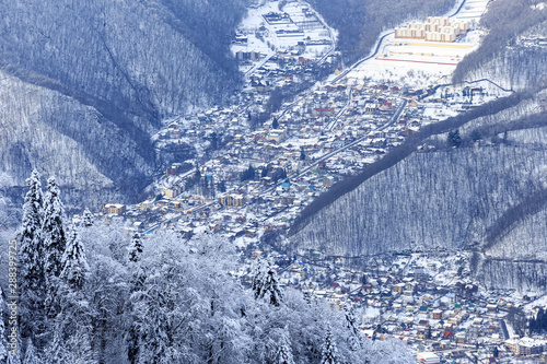 Krasnaya Polyana village and mountain ski resort at snowy winter in Caucasus mountains. Scenic landscape. Sochi, Russia