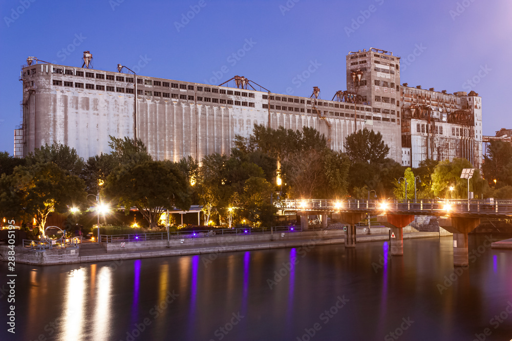 The old grain silos in the port of Montreal by sunset