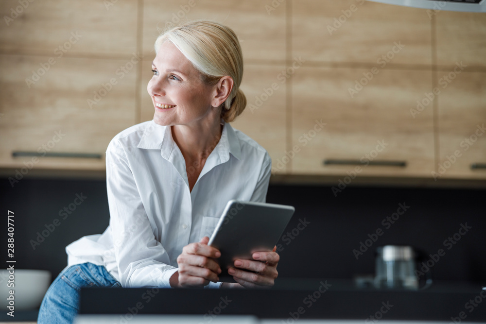 Beautiful adult lady is looking away indoors Beautiful adult lady is looking away indoors