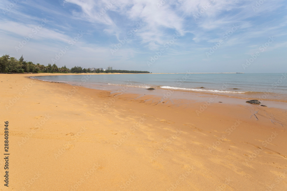 Haikou beach and sea, sky, clouds, palm trees Hainan, China