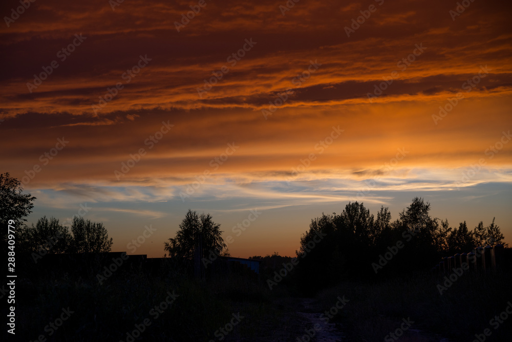 Sunset sky in summer village