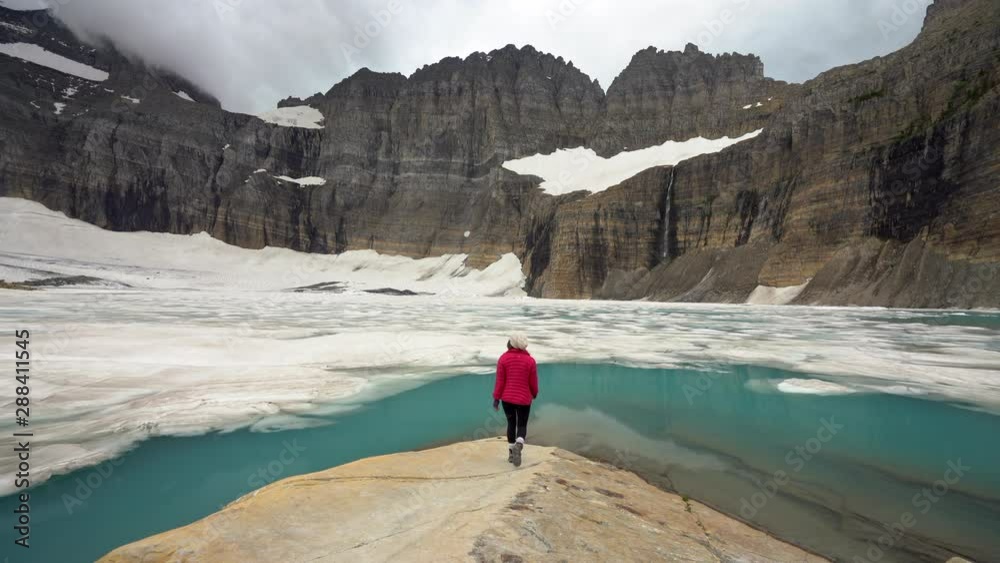 Woman Approaches Icy Grinnell Glacier And Salamander, Montana, USA