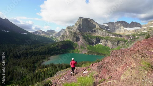 Female Eco Tourist Looking Over Grinnell Lake and Angel Wing Montana, USA photo