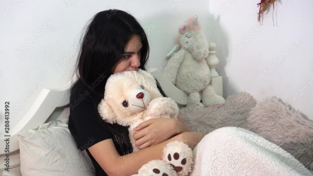 Depressed girl throws her teddy bear Depressed girl throws her teddy bear