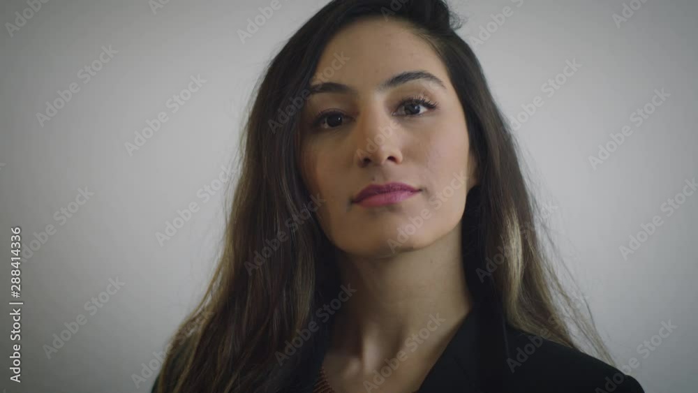 Young Latina Corporate Employee Portrait Looking Up Smiling Slow motion Young Latina Corporate Employee Portrait Looking Up Smiling Slow motion