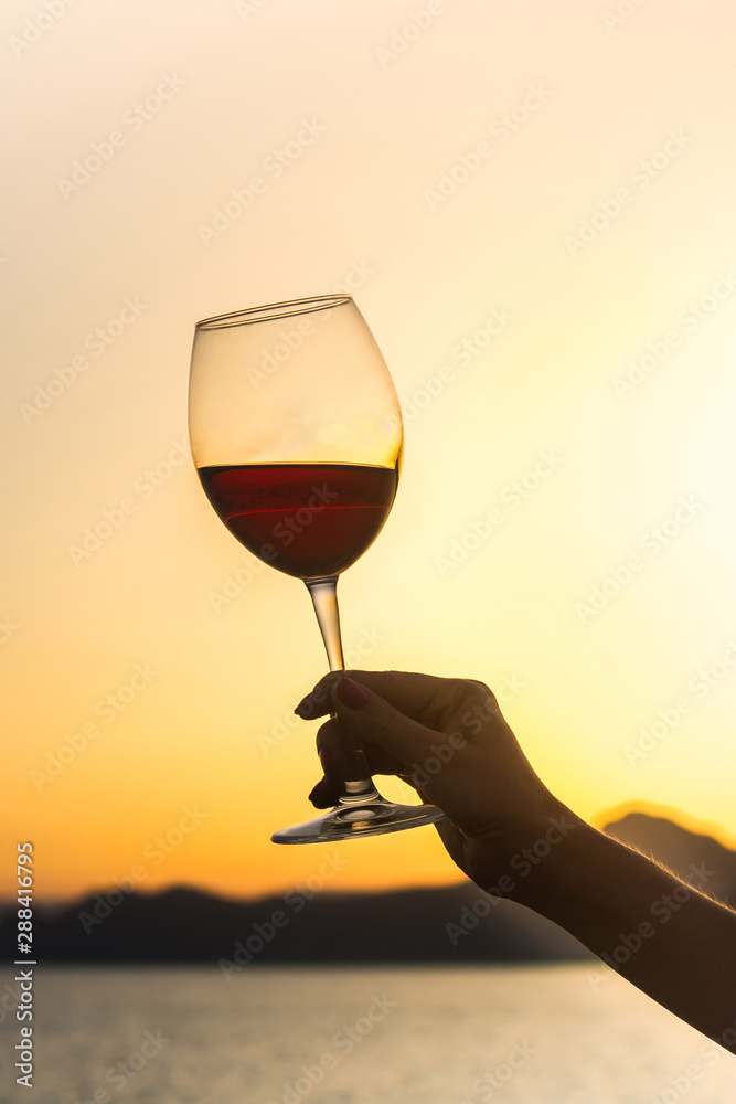 Glass of wine at sunset