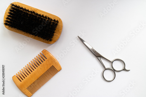 Comb, brush and scissors isolated on white background.