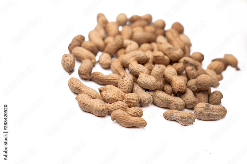 Useful peanut, close-up, isolated on white background. Protein source. Healthy food Useful peanut, close-up, isolated on white background. Protein source. Healthy food