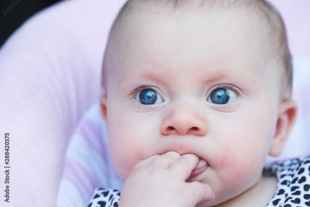 Portrait of 5 Month Old Cute Baby Girl with Big Eyes, Infant , New family concept, The most Beautiful Baby Princesse, Happy Baby Girl, Funny Face Expression, Sucking Thumb, Finger, Toe Portrait of 5 Month Old Cute Baby Girl with Big Eyes, Infant , New family concept, The most Beautiful Baby Princesse, Happy Baby Girl, Funny Face Expression, Sucking Thumb, Finger, Toe