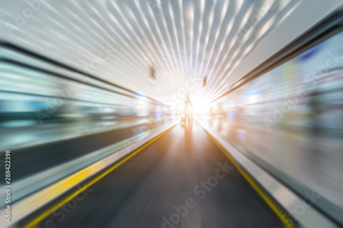 blurred motion of airport moving walkway