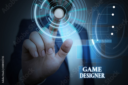 Handwriting text Game Designer. Conceptual photo Campaigner Pixel Scripting Programmers Consoles 3D Graphics Male human wear formal work suit presenting presentation using smart device