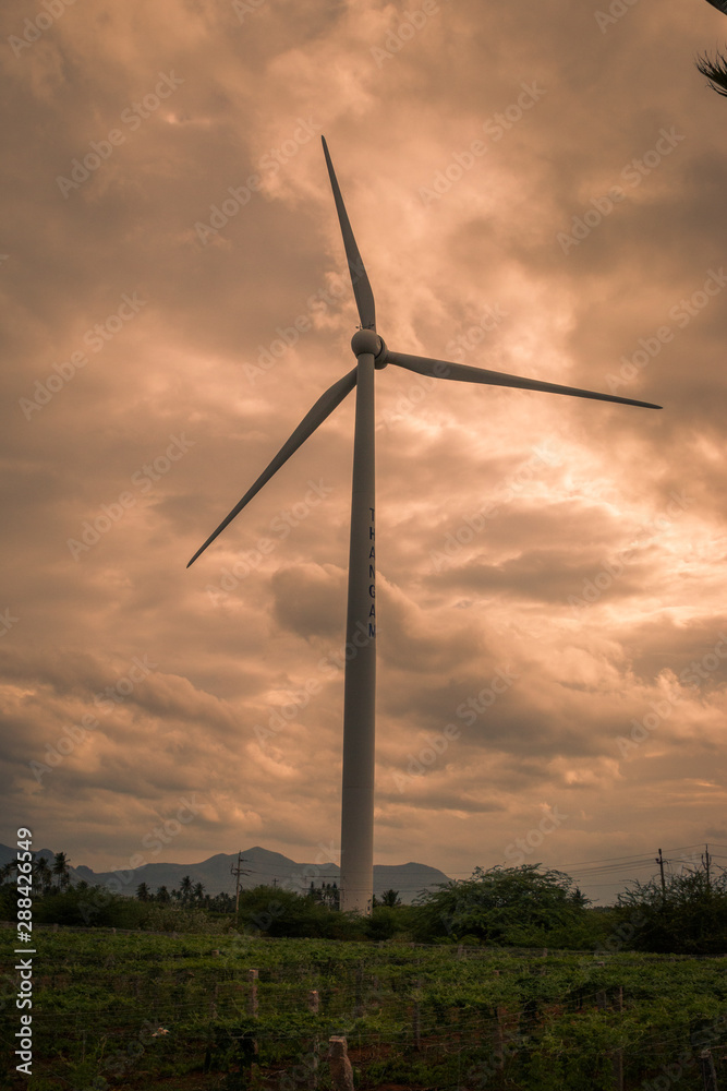 Windmill with cloudy background Windmill with cloudy background