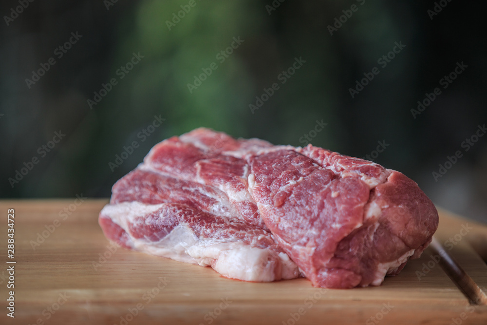 Close up raw pork on cutting board Close up raw pork on cutting board