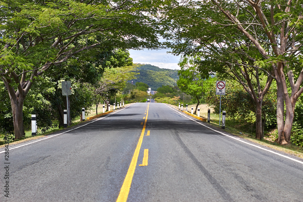 panoramic view of American road during the day without vehicles