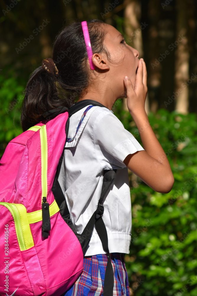 Naklejka premium Surprised Filipina Female Student Wearing School Uniform With Notebooks