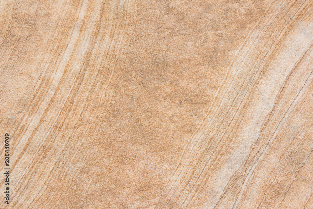 Weathered rock and sandstone wavy stripes closeup background Weathered rock and sandstone wavy stripes closeup background