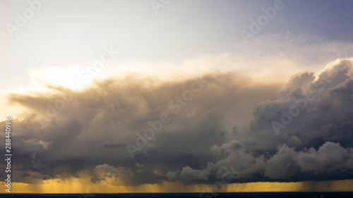 Aerial image of dark Storm clouds over the land. Aerial panorama of storm clouds. Panorama of thunder clouds. View from drone. Aerial bird's eye view. Aerial top view cloudscape. Texture of clouds.