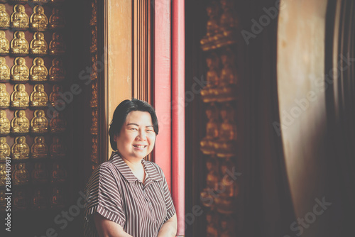Woman at Wat Boromracha Kanchanapisek Anusorn photo