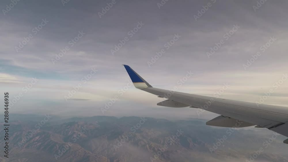 Time lapse video of a commercial regional jet making turns in the air while airborne. Wing view from airplane window seat. Time lapse video of a commercial regional jet making turns in the air while airborne. Wing view from airplane window seat.