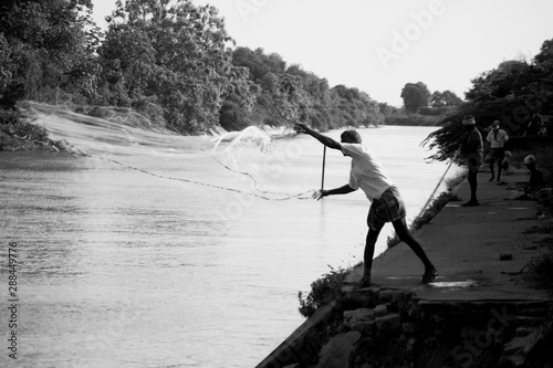 fisherman on lake